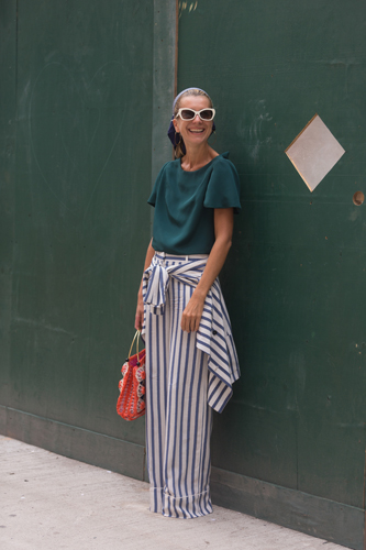 NEW YORK, NY - SEPTEMBER 08: Tales of Endearment blogger Natalie Joos wears an Audra top, vintaga raffia bag, and Tommy Hilfiger pants on Day 5 of New York Fashion Week Spring/Summer 2015 on September 8, 2014 in New York City. (Photo by Melodie Jeng/Getty Images)