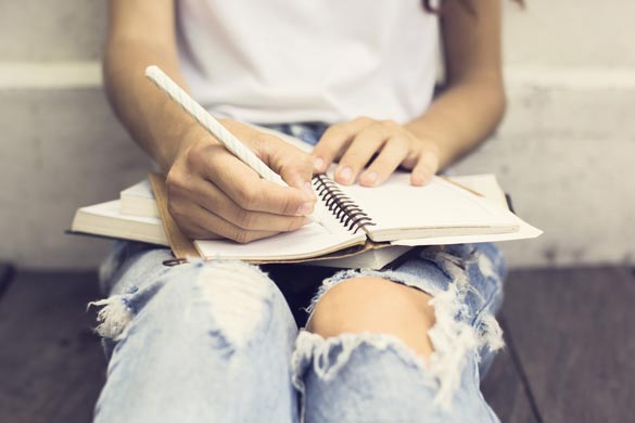 Gir-with-books-writing-in-the-diary