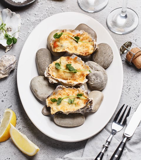 Recept: oesters gegratineerd met een Champagnesaus